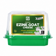 Packaged Ezine Goat Cheese in a vacuum-sealed container with a green lid, labeled with the brand MODA, product name, weight, and an illustration of goats on the front.